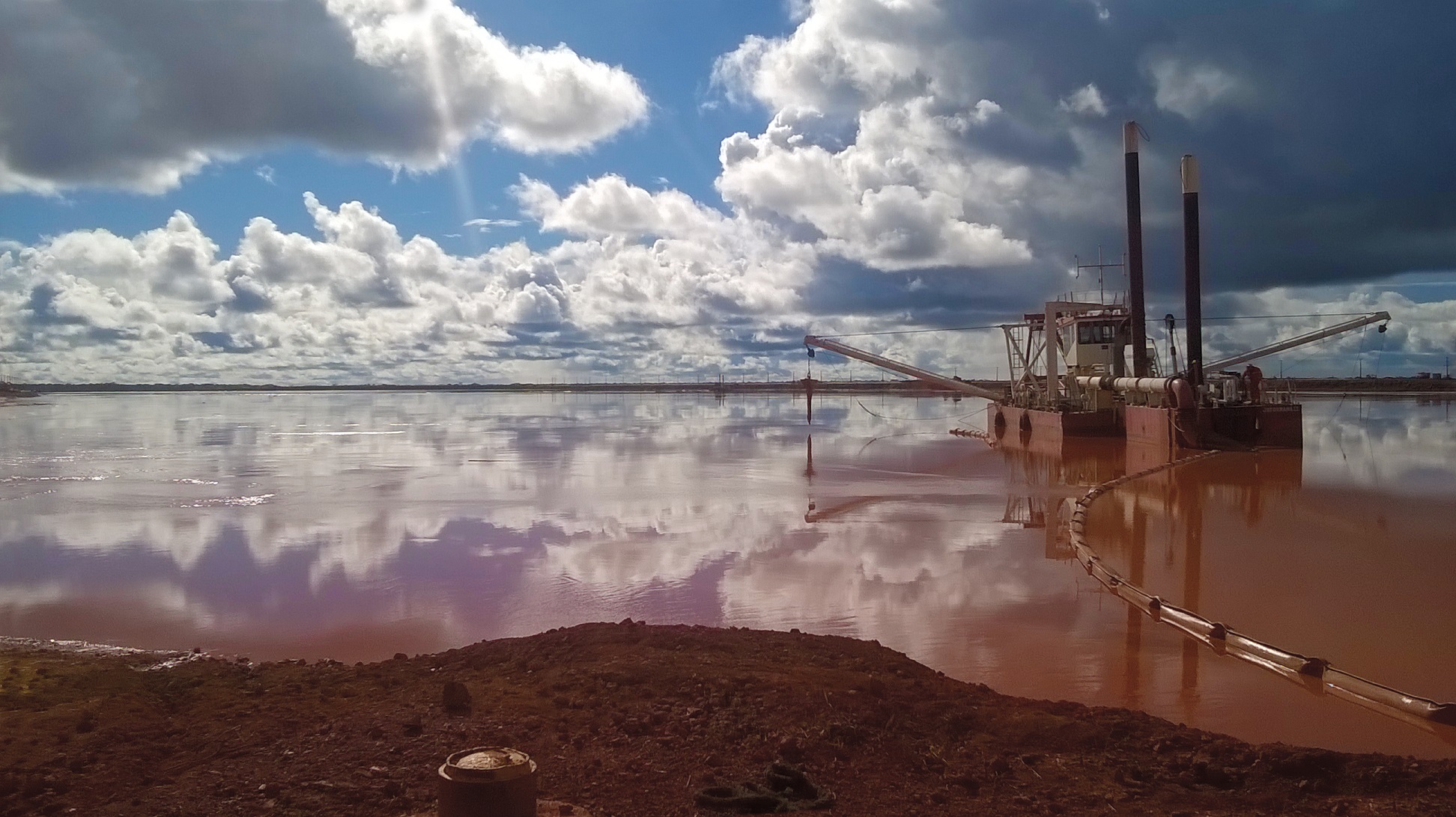 A cutter suction dredger working in a reservoir